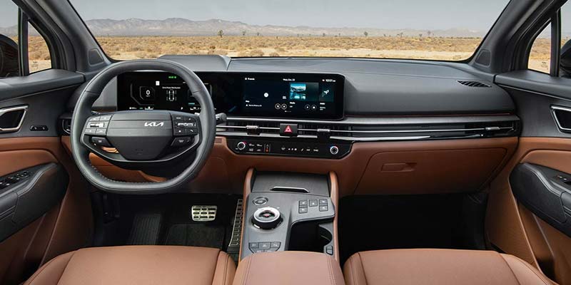 Kia interior with touchscreen infotainment and digital dashboard.