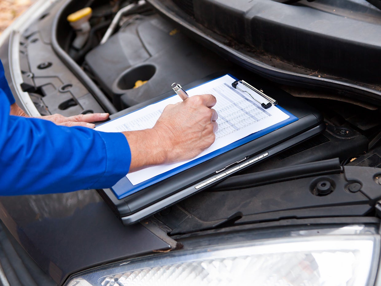 Kia vehicle undergoing a multi point digital inspection check